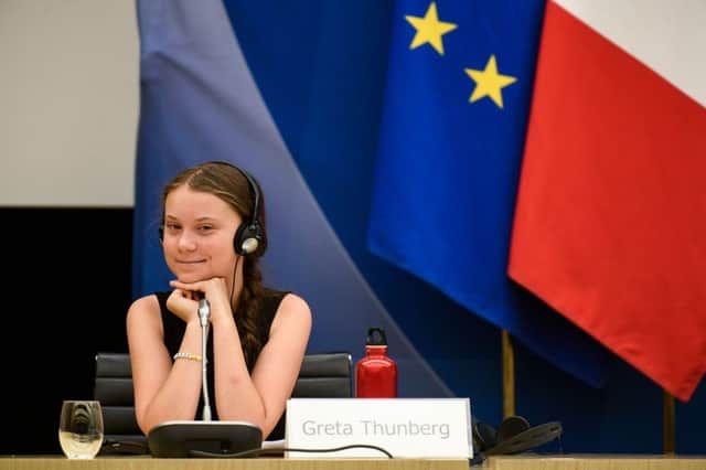 Swedish climate activist Greta Thunberg reacts after her speech during a meeting at the French National Assembly, in Paris, on July 23, 2019. (Photo by Lionel BONAVENTURE / AFP)LIONEL BONAVENTURE/AFP/Getty Images