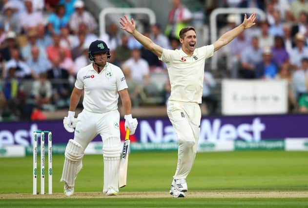 England's Chris Woakes, who took six for 17, appeals successfully to claim the wicket of Gary Wilson. Picture: Julian Finney/Getty