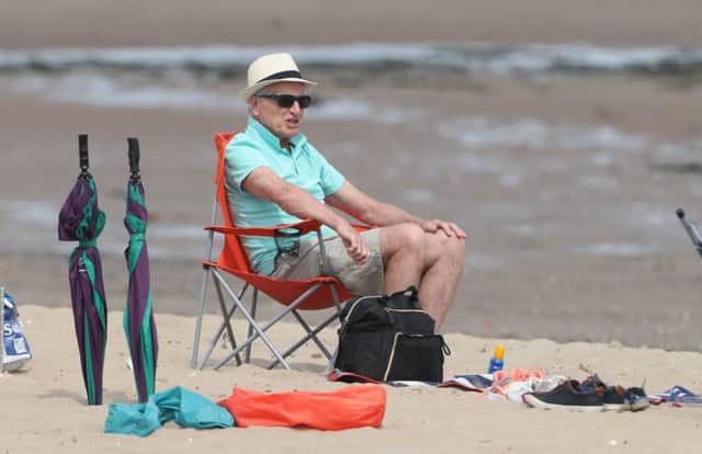 A man relaxes on Portobello beach in Edinburgh. Picture: PA