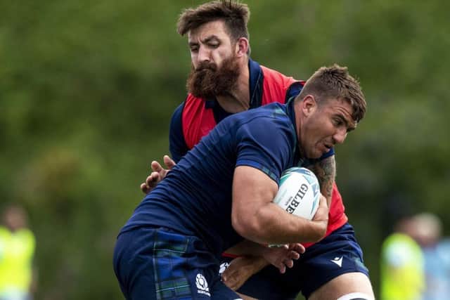Sam Skinner takes the ball into contact with Gary Graham during a Scotland squad training session at Murrayfield. Picture: SNS/SRU