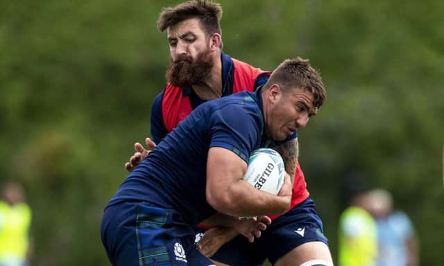 Sam Skinner takes the ball into contact with Gary Graham during a Scotland squad training session at Murrayfield. Picture: SNS/SRU