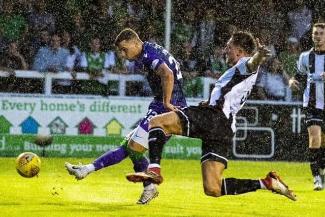 Florian Kamberi scores Hibs second goal to seal their victory over Elgin City at Borough Briggs. Picture: SNS.