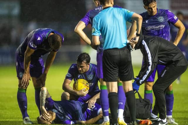 Hibs players console Martin Boyle after the winger went down injured late on against Elgin. Picture: Craig Foy/SNS