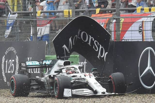 Lewis Hamilton manoeuvres his way back on to the track after crashing his car at the final corner of lap 29. Picture: AFP/Getty.