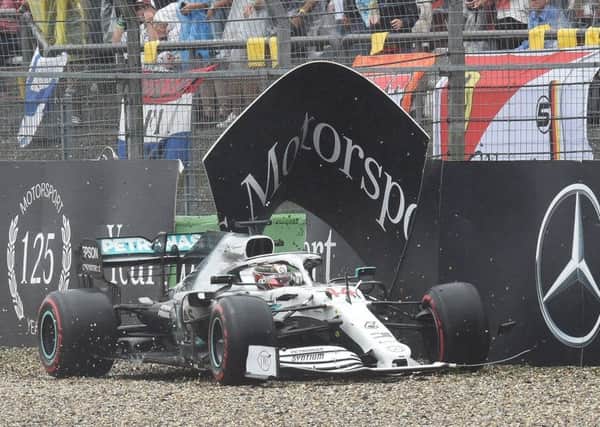 Lewis Hamilton manoeuvres his way back on to the track after crashing his car at the final corner of lap 29. Picture: AFP/Getty.