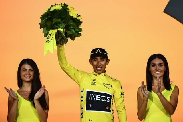 Egan Bernal celebrates on the podium in the leaders yellow jersey after securing victory in the Tour de France. Picture: AFP/Getty.
