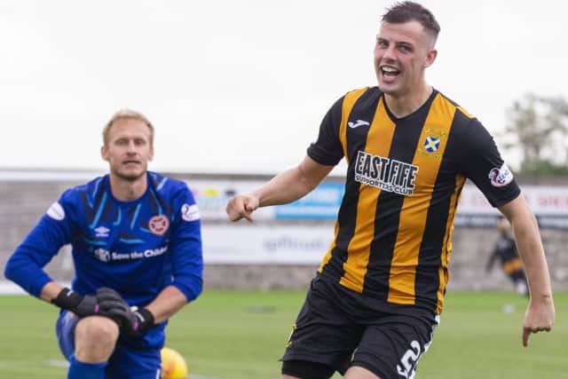 East Fife's Aaron Dunsmore laughs at Hearts goalkeeper Zdenek Zlamal after scoring the winning penalty in the shootout. Picture: Bruce White/SNS