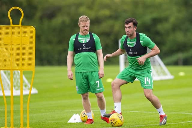 Hibs midfielder Stevie Mallan, watched in training yesterday by team-mate Daryl Horgan, has set his sights on breaking into Steve Clarkes Scotland squad. Picture: SNS.