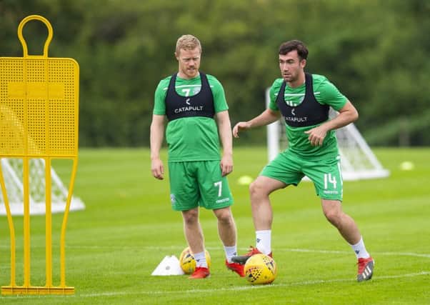 Hibs midfielder Stevie Mallan, watched in training yesterday by team-mate Daryl Horgan, has set his sights on breaking into Steve Clarkes Scotland squad. Picture: SNS.