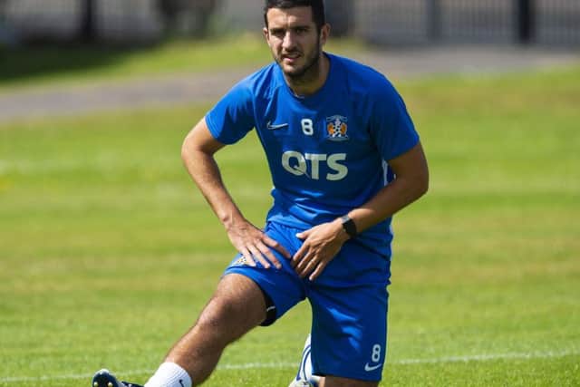 Kilmarnock's Gary Dicker limbers up for the start of the new Premiership season. Picture: Ross MacDonald
