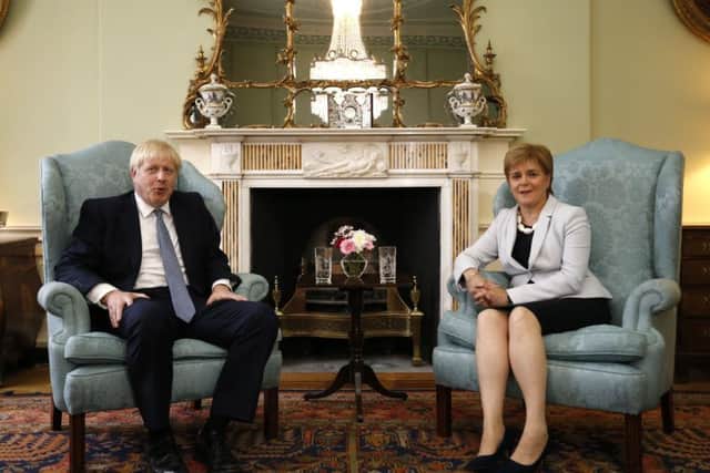 Boris Johnson poses for a photograph with Nicola Sturgeon at Bute House.(Photo by Duncan McGlynn /Getty Images)