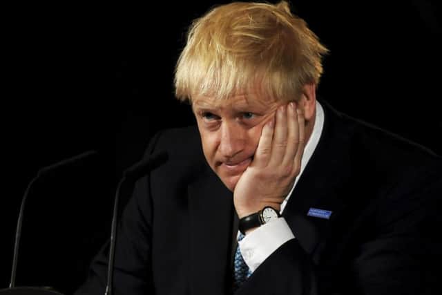Opponents of Prime Minister Boris Johnson accused him 'breaking the economy'.  (Picture: Rui Vieira/AP)
