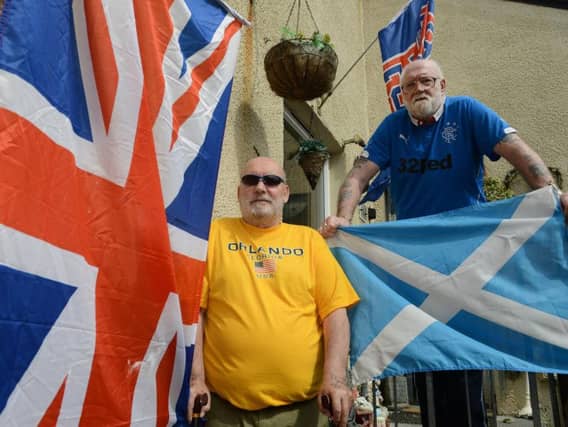 Duncan James, 70, and Joe Stirling, 74, from Troon, South Ayrshire, are next-door neighbours. Picture: SWNS