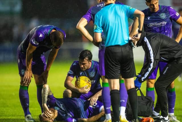 Martin Boyle receives treatment on the Borough Briggs turf