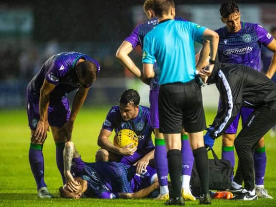 Martin Boyle receives treatment on the Borough Briggs turf