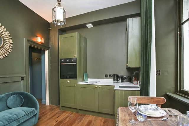 The open plan living area has a kitchen space.