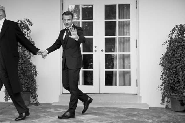 US President Donald Trump walks with France's President Emmanuel Macron to the Oval Office of the White House