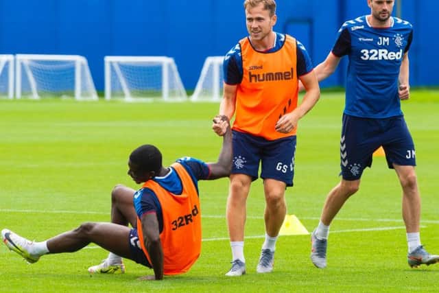 Sheyi Ojo, Greg Stewart and Jamie Murphy all wearing Hummel-branded training gear at the Hummel training centre