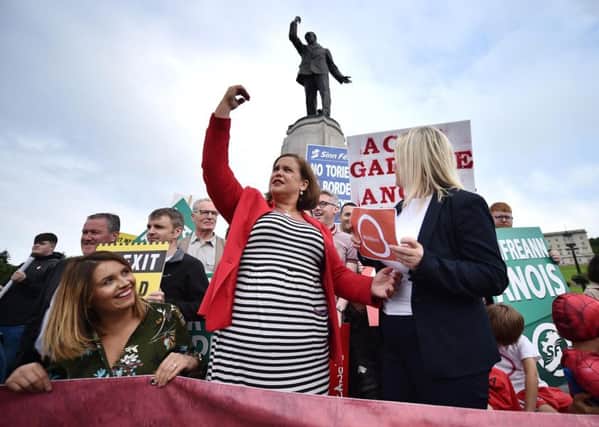 Sinn Fein leader Mary Lou McDonald emulates the pose of the Edward Carson statue as she and Sinn Fein vice-president Michelle O'Neill join a Brexit protest following their meeting with Prime Minister Boris Johnson at Stormont. Picture: Charles McQuillan/Getty Images