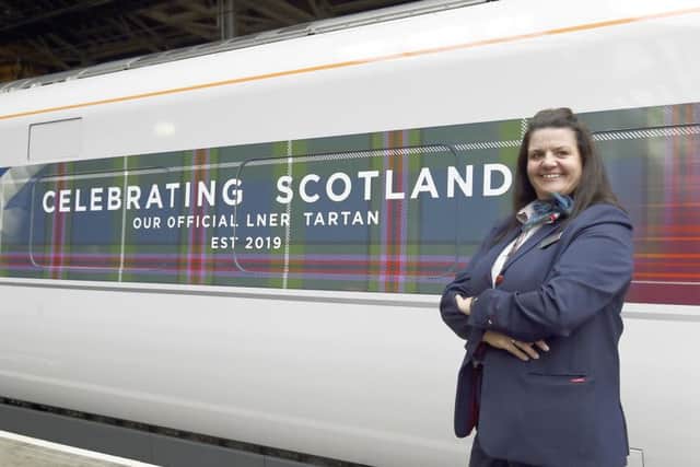 Azuma driver Sharon Geddes

 with the first Scottish train's new tartan livery. Picture: Lisa Ferguson