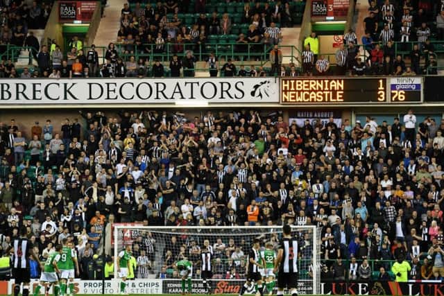 Newcastle United fans in the away end at Easter Road.