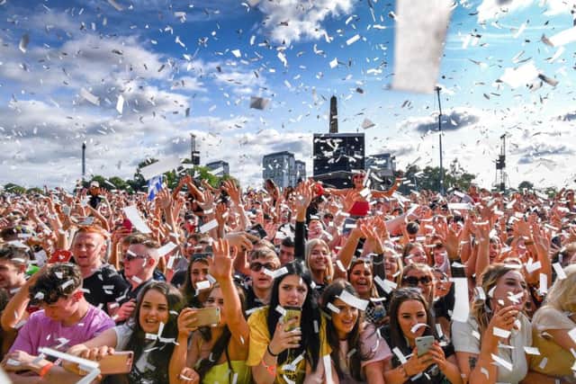 GLASGOW, SCOTLAND - JULY 12: Fans watch the Years & Years perform on the main stage during the TRNSMT Festival at Glasgow Green on July 12, 2019 in Glasgow, Scotland. Tens of thousands of people will visit Glasgow this weekend to attend Scotlandâ¬"s biggest music festival (Photo by Jeff J Mitchell/Getty Images)