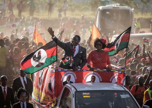 Opposition MCP leader Lazarus Chakwera waves to a crowd ahead of Mays general election, the result of which is disputed (Picture: Gianluigi Guercia/AFP/Getty)