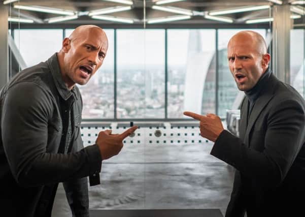 Dwayne Johnson as Luke Hobbs and Jason Statham as Deckard Shaw. Picture: PA Photo/Universal Pictures