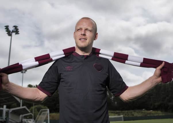 Steven Naismith has signed a four-year deal at Hearts.