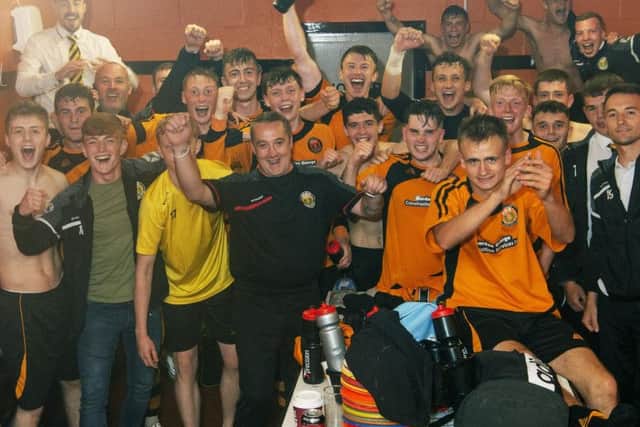 Fort William FC celebrate their tremendous victory.