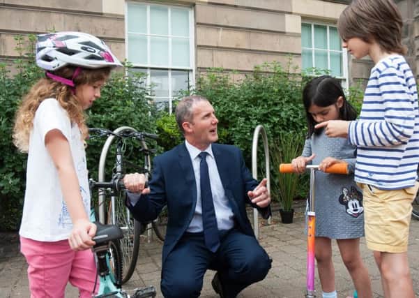 Transport Secretary Michael Matheson talks to young cyclists in Perth. Picture: Wullie Marr Photography