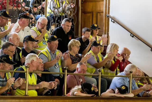 Workers watched on as city councillors considered their appeal. Photo: Press Association