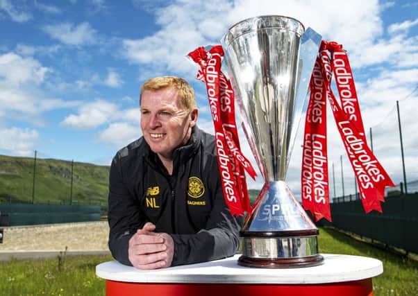 Neil Lennon with the Ladbrokes Premiership  trophy Celtic won for the eighth time in a row last season.