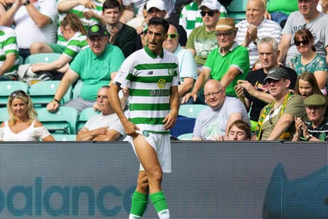Celtic's Hatem Abd Elhamed walks off with an injury. Pic: SNS