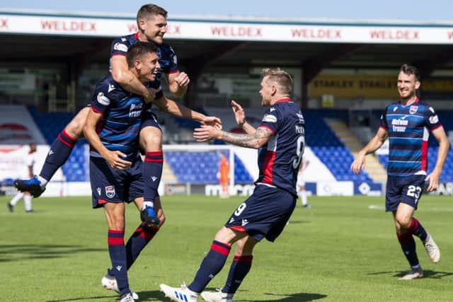Billy McKay (C) celebrates with teammates. Pic: SNS/Ross Parker
