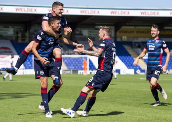 Billy McKay (C) celebrates with teammates. Pic: SNS/Ross Parker