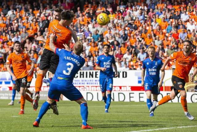 Dundee United new boy Lawrence Shankland bullets his third header in to make it 3-1. Photograph: Bruce White/SNS Group