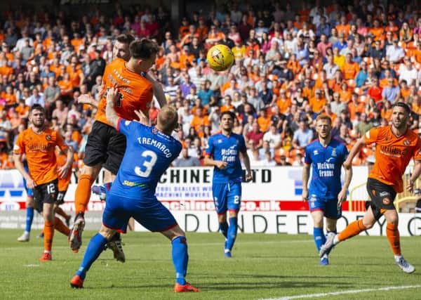 Dundee United new boy Lawrence Shankland bullets his third header in to make it 3-1. Photograph: Bruce White/SNS Group