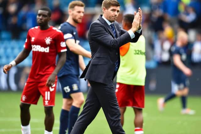 Steven Gerrard applauds the fans at full time
