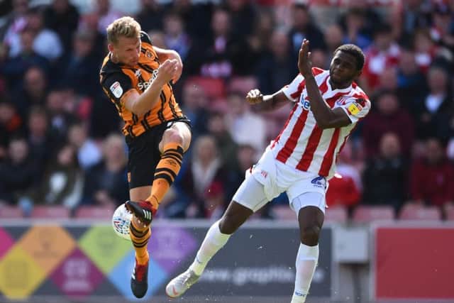 Hull defender Stephen Kingsley in action against Rhu-Endly Martina of Stoke City
