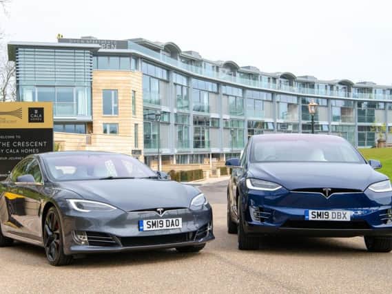 Motorists have been snapping up pure electric cars such as these Teslas. Picture: Ian Georgeson