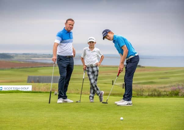 Stuart Graham, with sons Gregor, 15, and Connor, 12, helped create a family atmosphere at the Scottish Amateur.