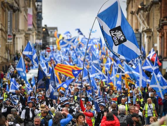 Independence supporters, seen here marching in Glasgow, will be buoyed by a new poll showing a 52-48 majority in favour of leaving the UK. (Picture: Jeff J Mitchell/Getty Images)