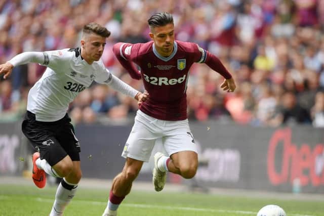 Mason Mount (left) battles for possession with Aston Villa's Jack Grealish