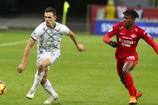Filip Uremovic (left) vies for the ball with Spartak Moscow's Sylvanus Nimely