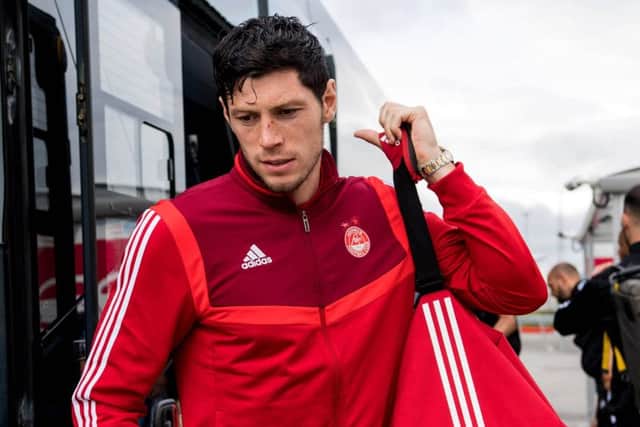 Aberdeen's Scott McKenna at the airport ahead of the flight to Croatia. Picture: SNS