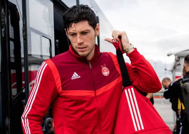 Aberdeen's Scott McKenna at the airport ahead of the flight to Croatia. Picture: SNS