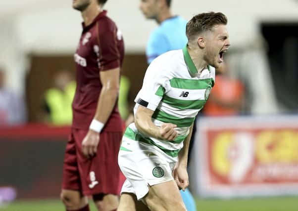 James Forrest celebrates after levelling for Celtic in the 37th minute.