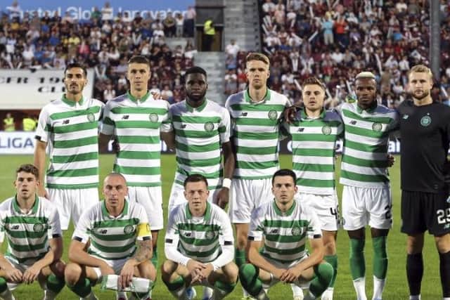 The Celtic players line up before kick-off.
