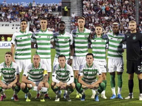 The Celtic players line up before kick-off.